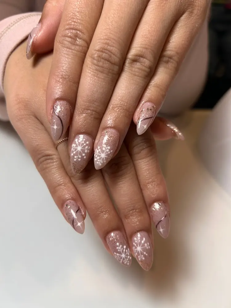 Dusty pink almond nails with glittery accent nails